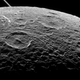 Illustration for article titled Stunning Image of Saturns Moon Captured from Just 300 Miles Above It